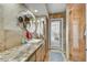 Bathroom with vanity, walk-in shower, and access to backyard at 13850 N 51St St, Scottsdale, AZ 85254