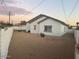 Large backyard with sand and a white fence at 16244 N 27Th Pl, Phoenix, AZ 85032