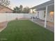 Artificial turf lawn, covered patio, and block wall at 16244 N 27Th Pl, Phoenix, AZ 85032