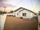 Large backyard with sand and a white fence at 16244 N 27Th Pl, Phoenix, AZ 85032