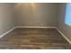 Simple bedroom with gray walls and wood-look flooring at 16244 N 27Th Pl, Phoenix, AZ 85032