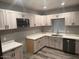 Modern kitchen with white cabinets and quartz countertops at 16244 N 27Th Pl, Phoenix, AZ 85032