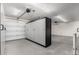 Garage with overhead storage and epoxy floor at 17750 W Larkspur Dr, Surprise, AZ 85388