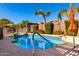 Relaxing swimming pool with a tiled border, perfect for summer at 17750 W Larkspur Dr, Surprise, AZ 85388