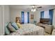 Bright bedroom with a large bed, TV, and ample closet space at 18648 N 27Th St, Phoenix, AZ 85050