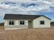 Single-story home with light-colored exterior and a dark-colored tile roof at 19111 W Nolan Dr, Buckeye, AZ 85326