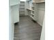 Spacious walk-in closet with ample shelving and hanging space at 19111 W Nolan Dr, Buckeye, AZ 85326