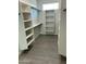 Bright walk-in closet with custom shelving at 19111 W Nolan Dr, Buckeye, AZ 85326