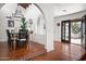 Charming dining room with rustic wooden table and chandelier, terracotta tile floors at 2022 E Bishop Dr, Tempe, AZ 85282