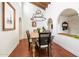 Elegant dining room with rustic table and chandelier, terracotta tile floors at 2022 E Bishop Dr, Tempe, AZ 85282