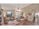 Bright dining room with hardwood floors and a view to the living room at 2146 E Electra Ln, Phoenix, AZ 85024