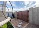 Backyard with trampoline and gate leading to the outside at 2161 E Gemini Dr, Tempe, AZ 85283
