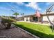 Backyard view showcasing artificial turf, patio furniture, and a shed at 2161 E Gemini Dr, Tempe, AZ 85283