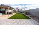 Artificial turf backyard with patio and string lights at 2161 E Gemini Dr, Tempe, AZ 85283
