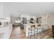 Open concept kitchen with island, stainless steel appliances, and light wood floors at 2161 E Gemini Dr, Tempe, AZ 85283