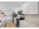 White kitchen cabinets and stainless steel appliances at 2161 E Gemini Dr, Tempe, AZ 85283