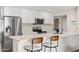 Modern kitchen features stainless steel appliances and a breakfast bar at 2161 E Gemini Dr, Tempe, AZ 85283