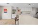 Updated kitchen with white cabinets, quartz countertops and wine rack at 2161 E Gemini Dr, Tempe, AZ 85283