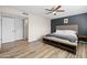 Large main bedroom with ensuite bathroom and ceiling fan at 2161 E Gemini Dr, Tempe, AZ 85283