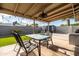 Covered patio with seating area, string lights, and artificial turf at 2161 E Gemini Dr, Tempe, AZ 85283