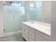 Double vanity bathroom with a large glass shower at 2550 N 149Th Ave, Goodyear, AZ 85395