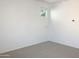 Well-lit bedroom featuring neutral wall paint and carpet at 2550 N 149Th Ave, Goodyear, AZ 85395