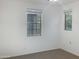 Bright bedroom with two windows and neutral decor at 2550 N 149Th Ave, Goodyear, AZ 85395