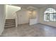 Modern entryway with staircase, tile flooring, and natural light at 2550 N 149Th Ave, Goodyear, AZ 85395