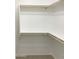 Large walk-in closet with double rods and shelving at 2550 N 149Th Ave, Goodyear, AZ 85395