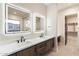 Spa-like bathroom with double vanity and LED mirrors at 256 E Tumbleweed Dr, Phoenix, AZ 85085