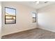 Simple bedroom with two windows and wood-look floors at 256 E Tumbleweed Dr, Phoenix, AZ 85085
