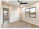 Bright bedroom with wood-look floors and large window at 256 E Tumbleweed Dr, Phoenix, AZ 85085