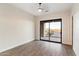 Bedroom with sliding door to patio and mountain views at 256 E Tumbleweed Dr, Phoenix, AZ 85085