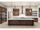 Gourmet kitchen with dark wood cabinetry, white subway tile, and stainless steel appliances at 256 E Tumbleweed Dr, Phoenix, AZ 85085