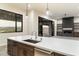 Modern kitchen island with white quartz countertops and stainless steel sink at 256 E Tumbleweed Dr, Phoenix, AZ 85085