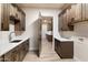 Long laundry room with wood cabinets and quartz countertops at 256 E Tumbleweed Dr, Phoenix, AZ 85085