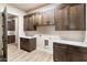 Laundry room features wood cabinets and a built-in bench at 256 E Tumbleweed Dr, Phoenix, AZ 85085