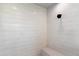 Walk-in shower with patterned tile and built-in seat at 256 E Tumbleweed Dr, Phoenix, AZ 85085