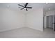 Well-lit bedroom with mirrored closet doors and ceiling fan at 27625 N Denver Hill Dr, Wittmann, AZ 85361