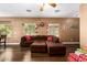 Living room with sectional sofa and wood flooring at 282 E Dry Creek Rd, San Tan Valley, AZ 85143