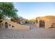 A whimsical, earthy-toned play area with unique structures at 29411 N 123Rd Ln, Peoria, AZ 85383