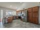 Modern kitchen with stainless steel appliances and wood cabinets at 3449 W Muriel Dr, Phoenix, AZ 85053