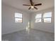 Bright bedroom with ceiling fan and large windows at 3720 N San Carlos Dr, Eloy, AZ 85131