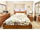 Cozy bedroom with wooden furniture and floral bedding at 404 E Paseo De Isabella --, Casa Grande, AZ 85122