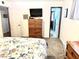 Bedroom featuring wooden furniture, floral bedding, and a TV at 404 E Paseo De Isabella --, Casa Grande, AZ 85122