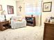 Cozy sitting area in a bedroom with a loveseat, end table, and decorative items at 404 E Paseo De Isabella --, Casa Grande, AZ 85122