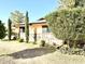 Side view of the house showcasing stone accents and lush greenery at 404 E Paseo De Isabella --, Casa Grande, AZ 85122