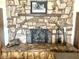 Stone fireplace with decorative screen and hearth at 404 E Paseo De Isabella --, Casa Grande, AZ 85122