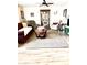 Spacious living room with hardwood floors, comfy seating, and a large display cabinet at 404 E Paseo De Isabella --, Casa Grande, AZ 85122