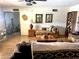 Living room with hardwood floors, cozy seating arrangement, and access to another room at 404 E Paseo De Isabella --, Casa Grande, AZ 85122